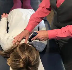 images of a person getting an adjustment by instrument